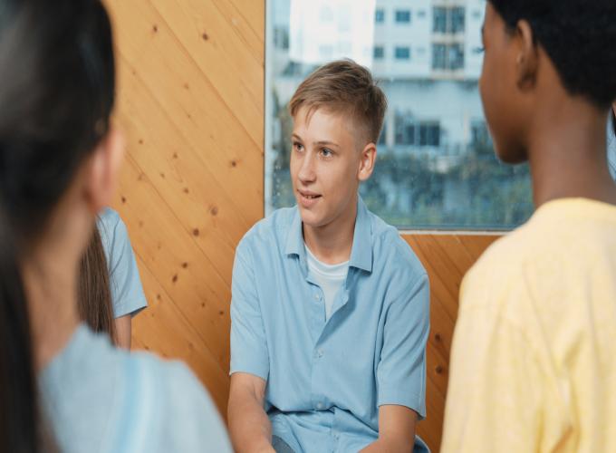 Group addiction recovery treatment with teens